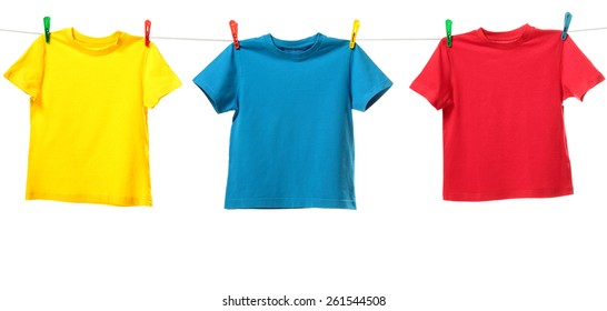 Three Colorful Shirts Hanging On The Clothesline. Image Isolated On White Background  