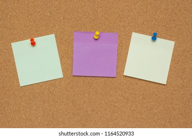 Three colorful sticky notes with pushpins and blank space, isolated on cork background, school concept - Shutterstock ID 1164520933