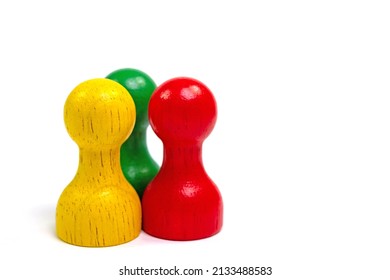 Three Colorful Wooden Skittles Against White Background