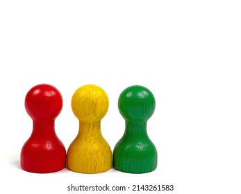 Three Colorful Wooden Skittles Against White Background