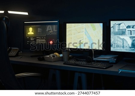 Three computer monitors displaying digital map, surveillance footage, and user profile on dark desk with keyboard, telephone, takeaway coffee cup and pastry box in modern workspace