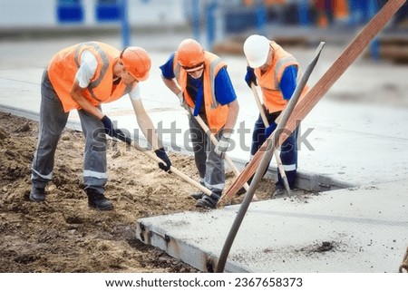 Similar – Image, Stock Photo Three men in orange