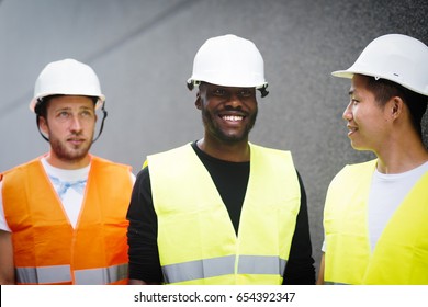 Three Construction Workers Walking 