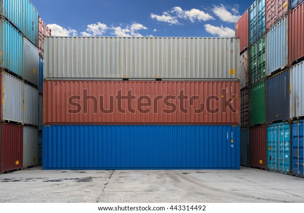 Three containers without labels. Sea\
container terminal. Storage containers\
area.
