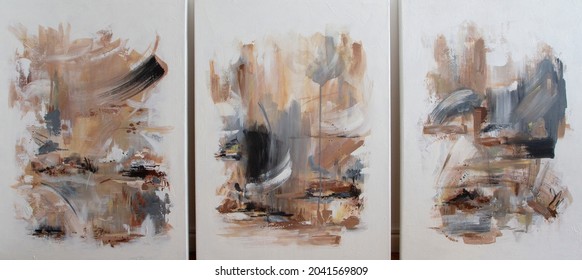 Three contemporary abstract paintings on the art studio. Nonfigurative abstract paintings of the same artistic series with colorful stains and strong brush texture.
