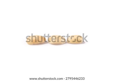 Three cooked Shandong peanuts without skin on white background, perfect for food photography and culinary content