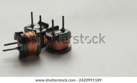 Three copper coils, also referred to as inductors.