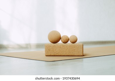 Three Cork Massage Balls For Fascia On A Cork Block On A Cork Yoga Mat. Concept: Eco Friendly And Biodegradable Props For Self Care At Home