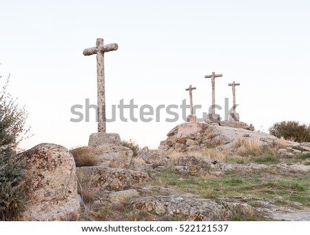 Three Crosses of carved stone on granite rock at dusk of Heaven Foto stock © 