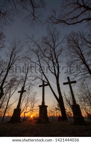 Three crosses at firey sunset