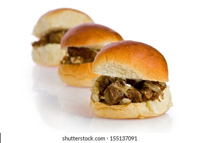 Three Cuban Shredded Beef, Or Vaca Frita, Sliders Against A White Background.