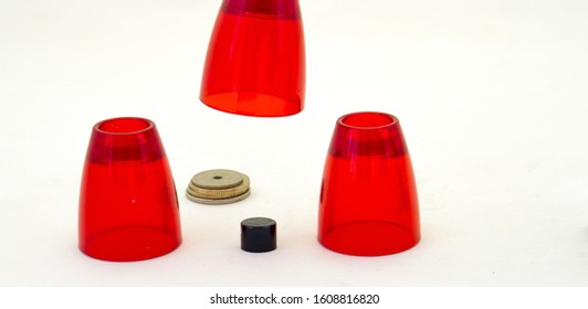 Three Cup Confidence Trick Isolated On A White Background Image In Horizontal Format