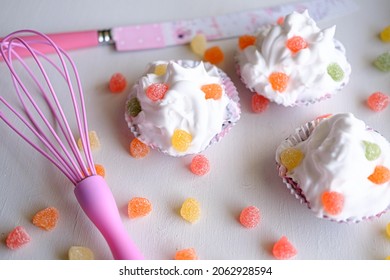 Three Cupcakes With Jelly Beans On Bright White Background. Cupcakes With Knife And Orange, Red, Pink Jellybeans.