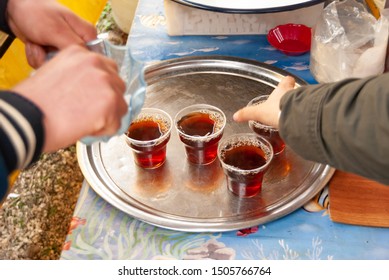 Three cups of tea on a serving tray. Selective focus.