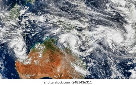 Three Cyclones Churn Off Australia. While powerful cyclone Pam headed toward Vanuatu, two other storms neared Australia. Elements of this image furnished by NASA. - Powered by Shutterstock