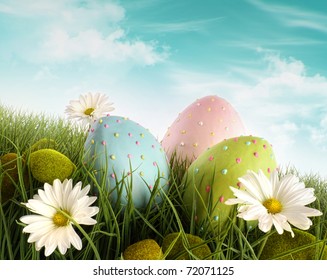 Three Decorated Easter Eggs In The Grass With Daisies