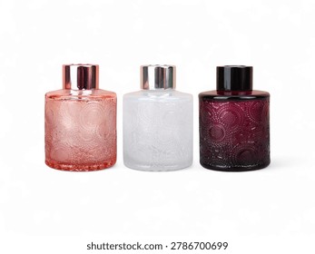 Three decorative scent bottles for aromatherapy in pink white purple