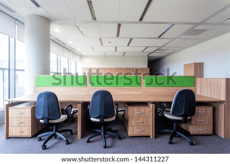 Three desks in the new contemporary office interior