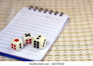 Three dices with notepad for business concept