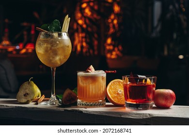 Three different beautiful cocktails in warm colors on a flower background. cocktail or bar menu concept. - Shutterstock ID 2072168741