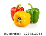 Three different colored of sweet bell peppers (capsicum) isolated on white background.
