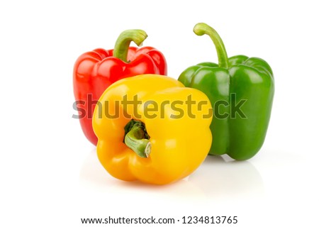 Three different colored of sweet bell peppers (capsicum) isolated on white background.
