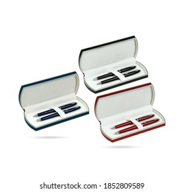 Three Different Colors Pencil Box. Two Gift Pens In Classy, Opened Plastic Pencil Box Isolated On A White Background. Plastic Box Packaging For Promotional Branding. 