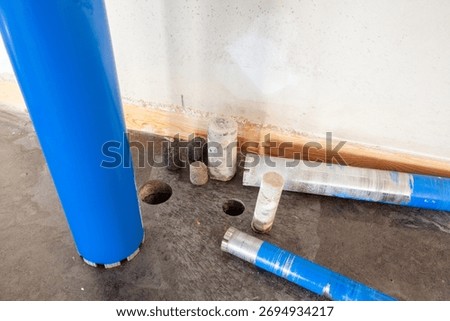 Three different diameter diamond drill bits for drilling in concrete