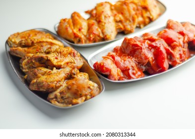 Three Different Set Of The Chicken Wings With Sriracha Glaze, Caribbean Marinade And Chinese Glaze, Meals World Cuisine Prepared To Cook