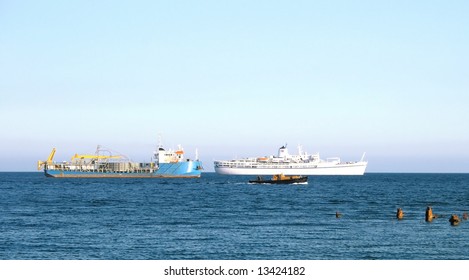 Three different ship and old broken pier.