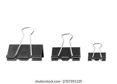 Three different sizes of black binder clips on a white background.