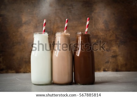Three Different Sorts Beverage Milk Cocoa Chocolate Bottle Wooden Background Top View