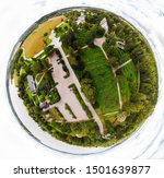 A three dimensional panoramic view of the medieval greystone Church of St. Mary in Hollola, Finland in a mini planet panorama style.