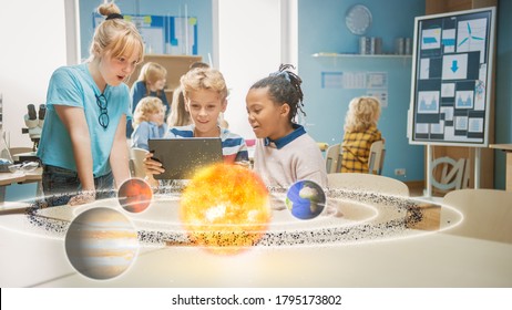 Three Diverse School Children in Science Class Use Digital Tablet Computer with Augmented Reality Software, Looking at Educational 3D Animation Of Solar System. VFX, Special Effects Render - Shutterstock ID 1795173802