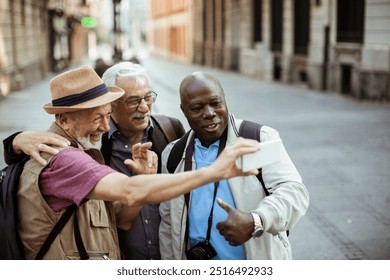 Three diverse senior male friend tourist exploring city - Powered by Shutterstock