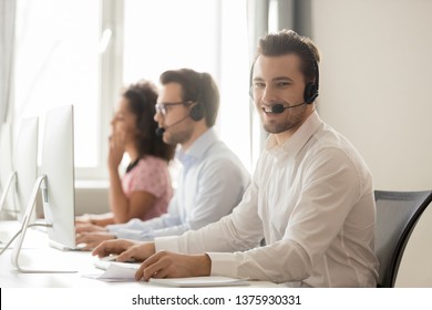 Three Diverse Workers Service Phone Call Center Operators Working Wearing Headset Use Pc, Focus On Smiling Team Member Looks At Camera, Support Everyday, Opportunity To Grow And Develop Career Concept