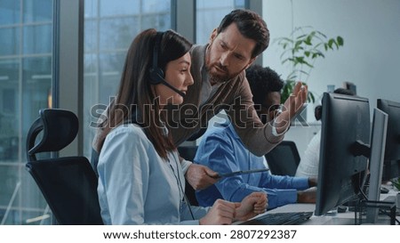 Three diversity operators working in call center angry CEO checking business work dissatisfied talking to intern sad woman. Group multiethnic team work in callcenter boss check bad job talk negative