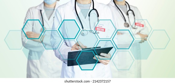 Three Doctors Stand In A Group Standing Side By Side, Holding A Tablet For Notes And A Stethoscope. Medical Background With Blue Rectangles And Copy Space. Medical Background With Doctors.