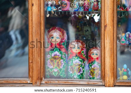 Three dolls of nested dolls behind the glass. Nested dolls.