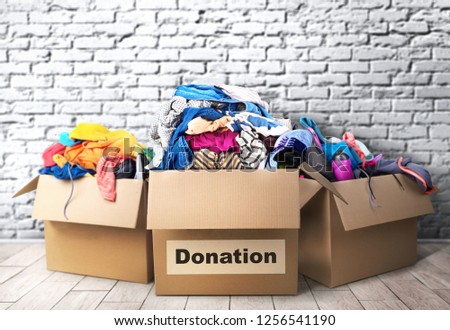 Three donation boxes in room