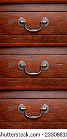 Three Drawer Dresser. Close Up Detail Of Handles And Wood Grain Finish.