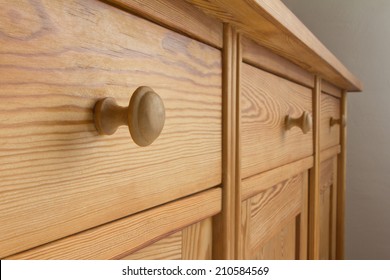 Three Drawers Of A Vintage Chest With Knobs Or Handles, Natural Brown Soft Wood, Old Wooden Furniture, Close Up