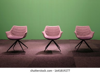 Three empty chairs in a studio with green screen - Shutterstock ID 1641819277