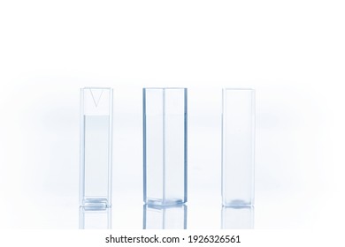 Three empty cuvettes used for measuring the concentration of a solution.