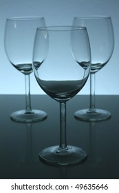 three empty wine glasses