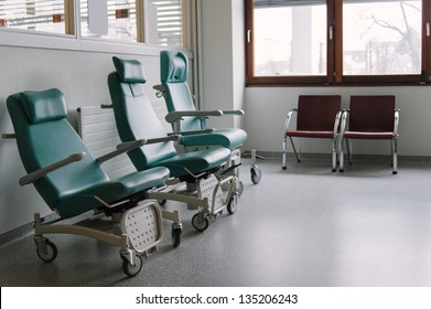 Three Ergonomic Empty Chairs In The Waiting Room Of A Modern Hospital Station