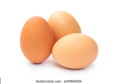 three farm brown chicken eggs on a white background