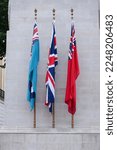 three flags on the Cenotaph to commemorate the deads of all wars, London, UK