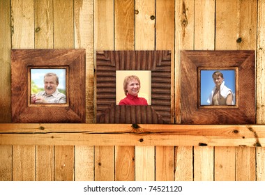 Three Frames With Family Photos On Wooden Wall