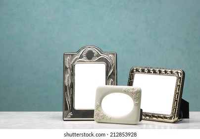 Three frames Group of photo frames on the marble table and white pictorial